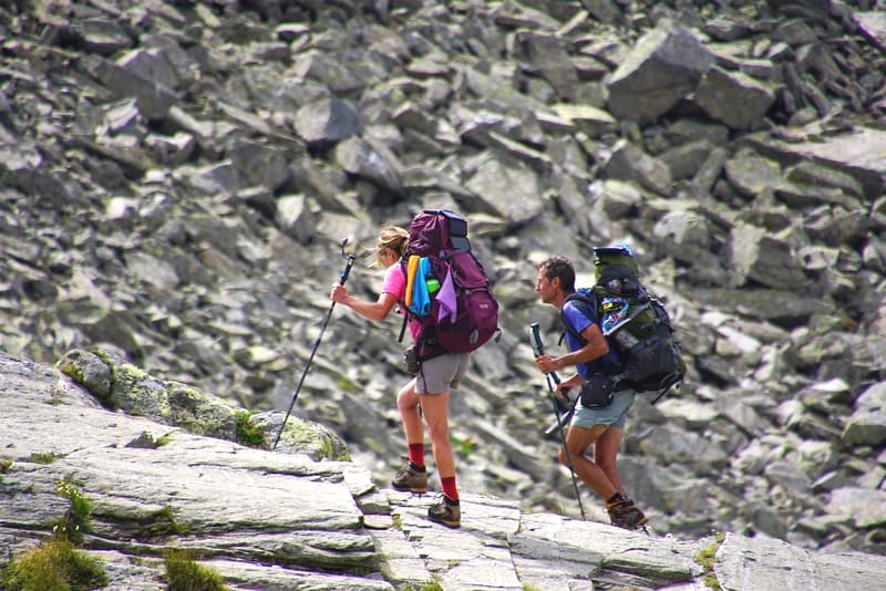 men and women climbing